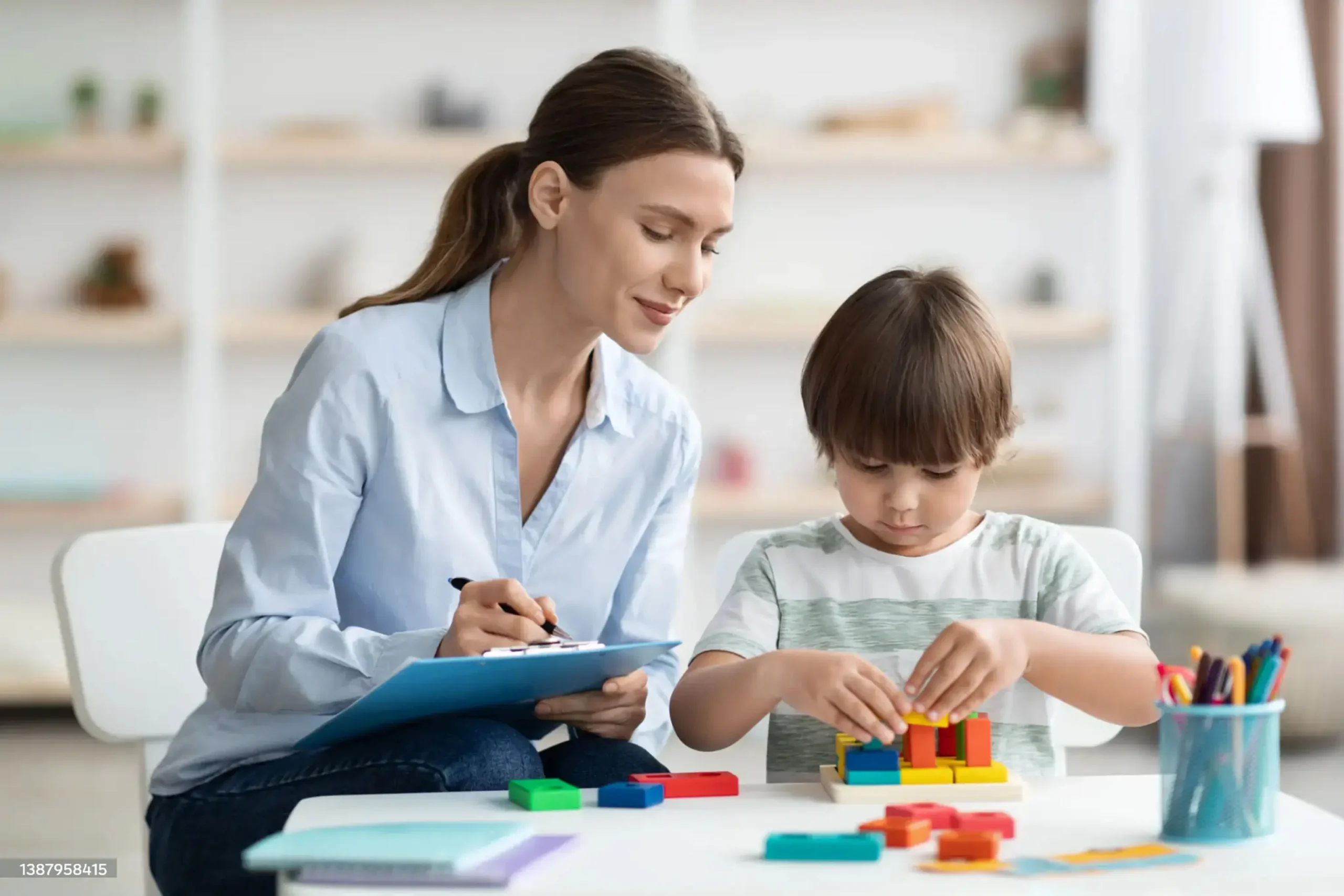 woman and a child engage in a project, sharing ideas and working closely at a table